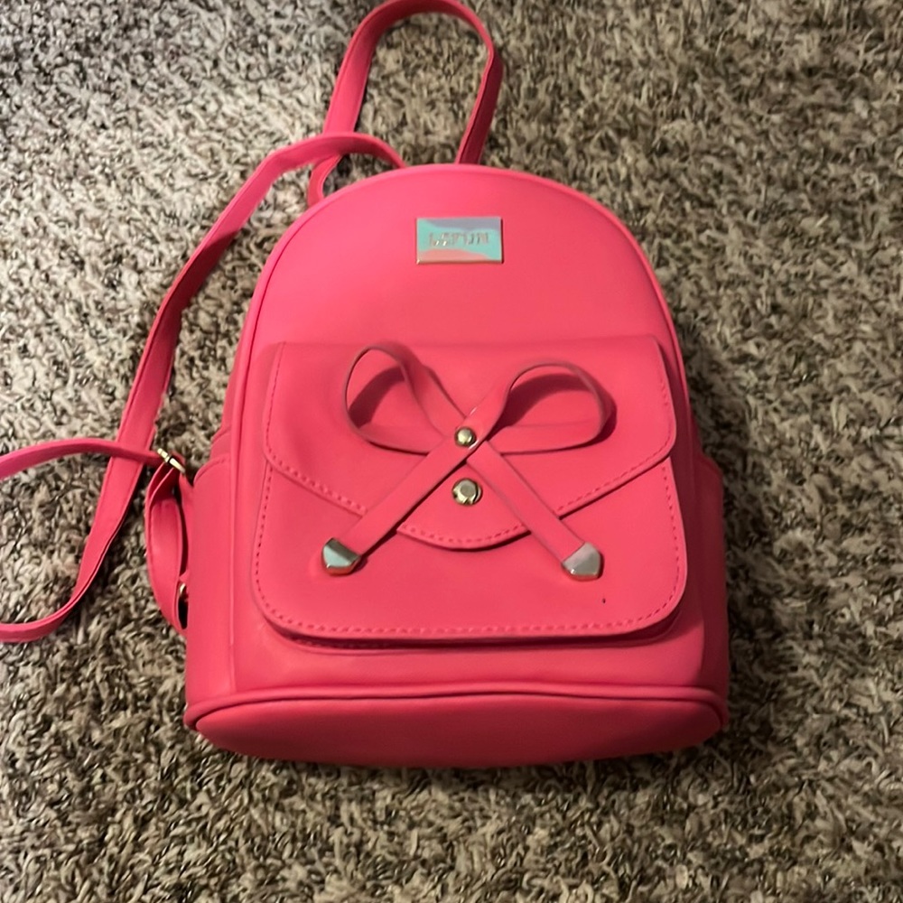 Bright pink, backpack with pockets and backpack straps